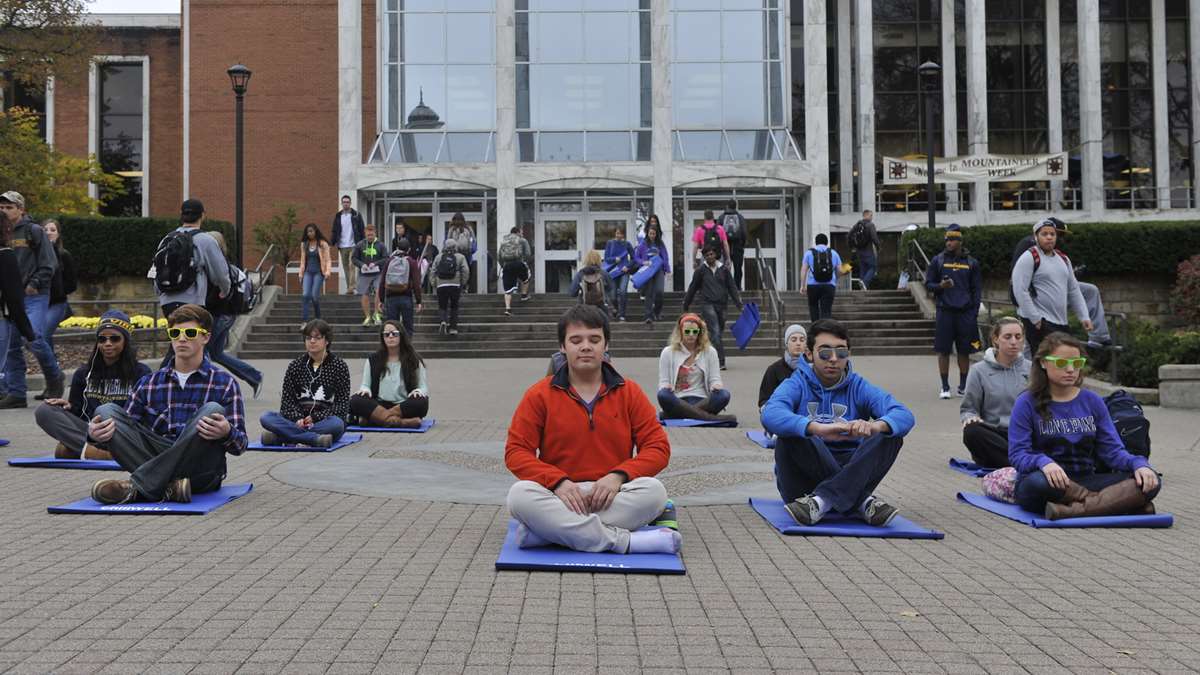 WVU students meditating in front of the Mountainlair